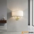 Kinkiet dwupunktowy złoty z białym abażurem 70562 z serii Nixon - Endon Lighting