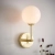 Kinkiet mosiężny z białą kulą 75960 z serii Otto - Endon Lighting