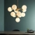 Lampa wisząca złota 11-punktowa z białymi kulami 76500 z serii OSCAR - Endon Lighting